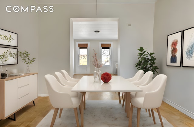 dining space featuring baseboards