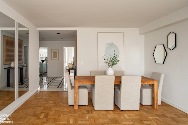 dining area featuring baseboards