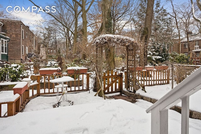 view of yard layered in snow