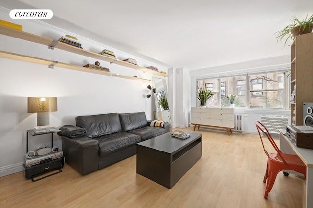 living room featuring light wood-style floors and visible vents