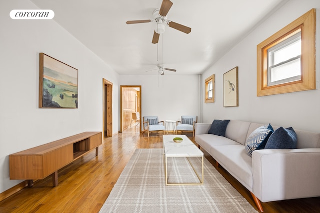 living room featuring visible vents and wood finished floors