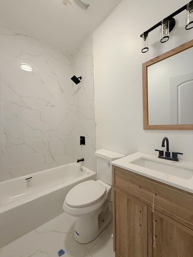 bathroom with toilet, marble finish floor, vanity, and  shower combination