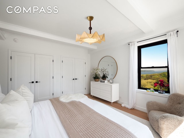 bedroom featuring baseboards and light wood-type flooring