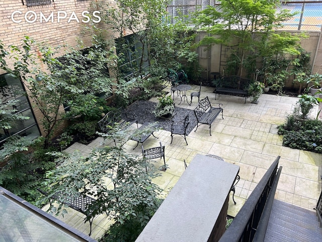 view of patio featuring fence