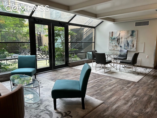 sunroom / solarium with visible vents and beam ceiling