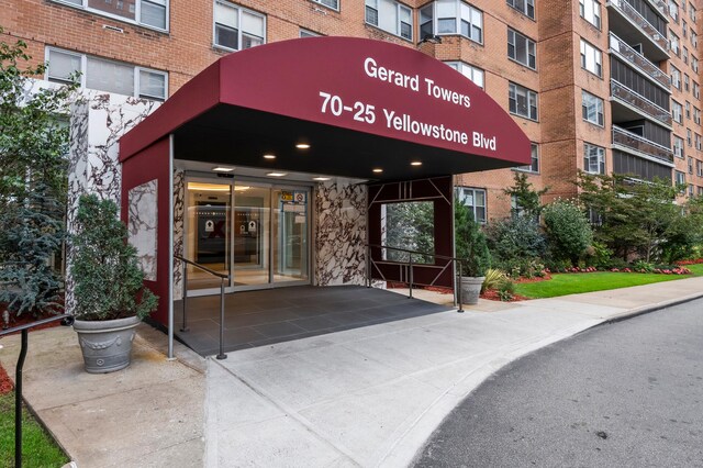 property entrance with brick siding