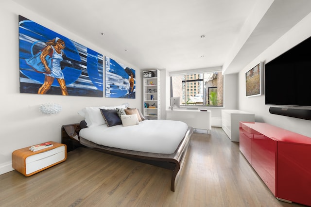 bedroom featuring wood finished floors