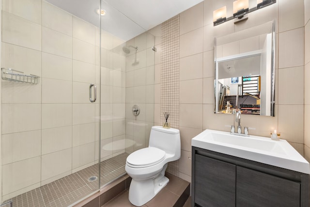 301 E 52nd St Phc, Phc, New York City, NY 10022 - full bath with tile walls, tile patterned flooring, a shower stall, vanity, and toilet