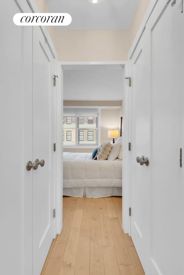 hallway with light wood-type flooring