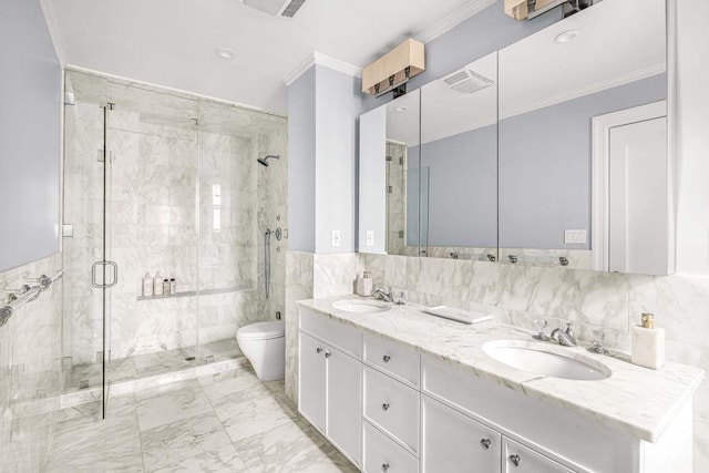 full bath with toilet, crown molding, tile walls, and a sink