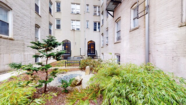 property entrance featuring brick siding