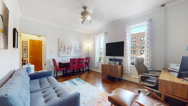 living room with baseboards, crown molding, a ceiling fan, and a baseboard radiator