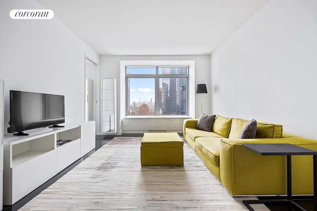 living room with wood finished floors and visible vents