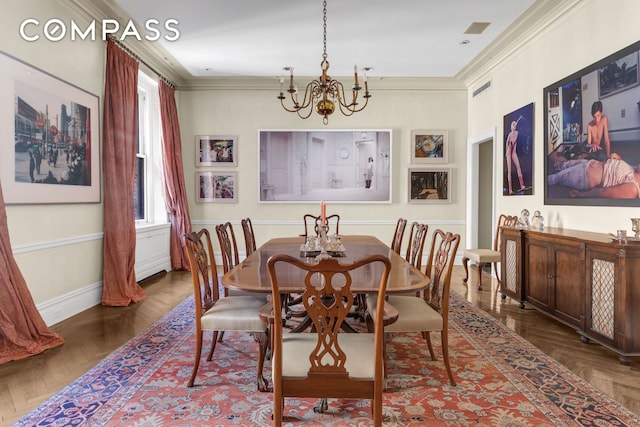 dining space with visible vents, crown molding, and an inviting chandelier