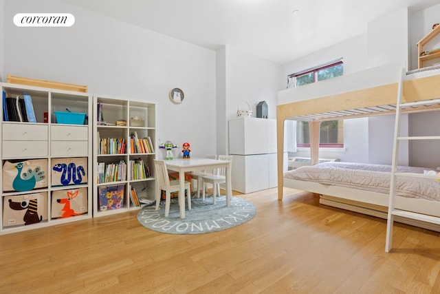 bedroom with visible vents and wood finished floors