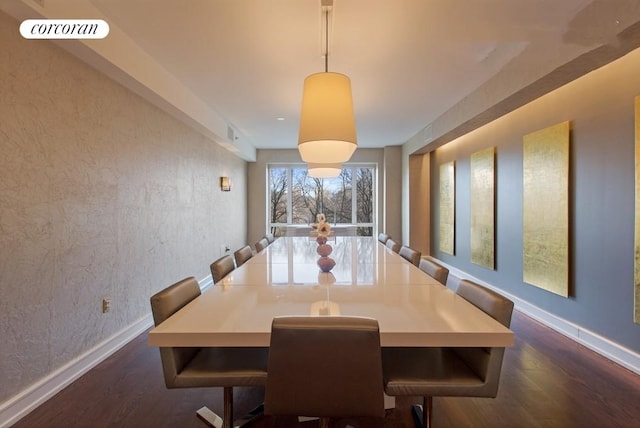 dining room featuring dark wood-style floors, visible vents, and baseboards