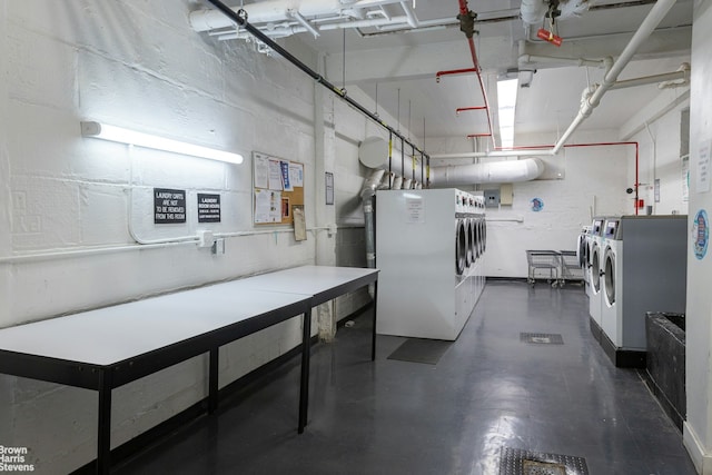 3840 Greystone Ave Unit 2O, New York City, NY 10463 - basement featuring washing machine and clothes dryer and electric panel