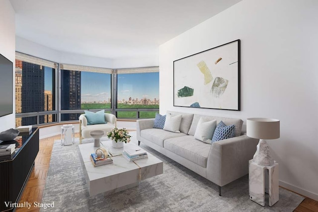 living area with a view of city and baseboards