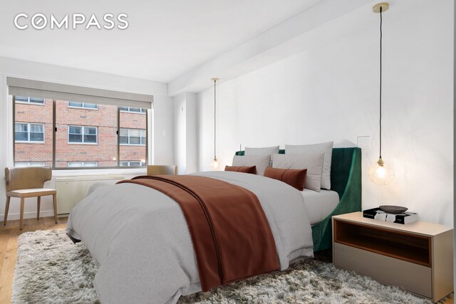 bedroom with wood finished floors