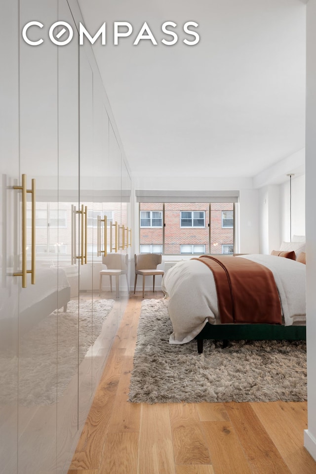 bedroom with light wood-style flooring