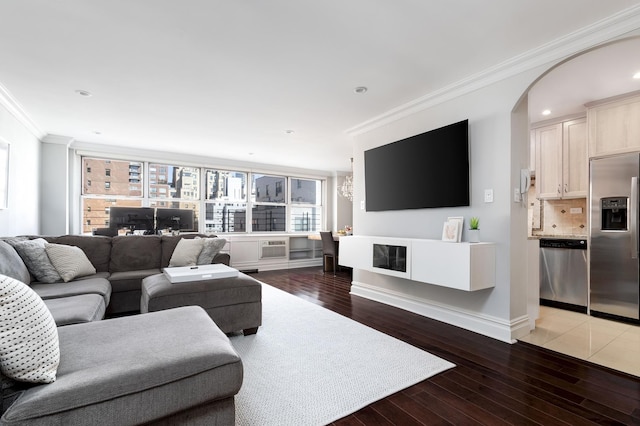 310 E 70th St Unit 10E, New York City, NY 10021 - living room with ornamental molding, light wood-style floors, baseboards, recessed lighting, and an AC wall unit