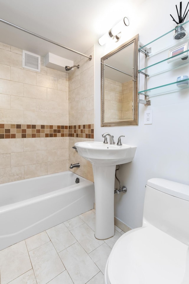 310 E 70th St Unit 10E, New York City, NY 10021 - full bath featuring toilet, tile patterned flooring, and shower / washtub combination