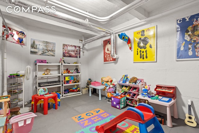 playroom featuring concrete floors