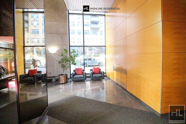 250 E 40th St Unit 4A, New York City, NY 10016 - lobby featuring expansive windows and wood walls