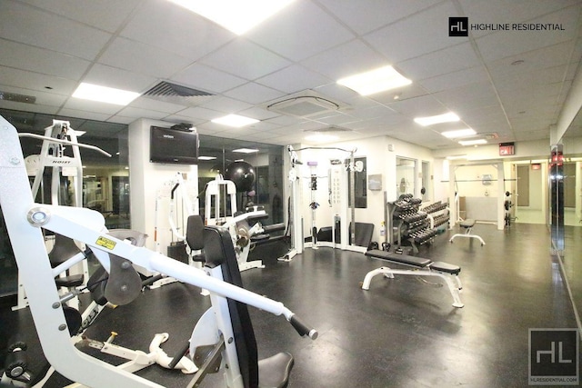 workout area featuring a drop ceiling and visible vents