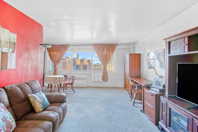 living room with light carpet and radiator