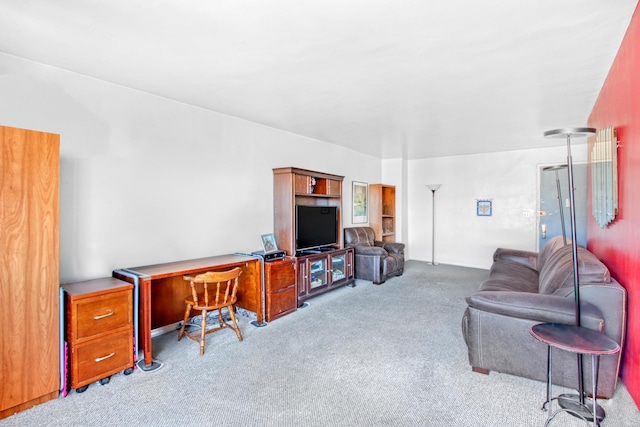 living area featuring light carpet