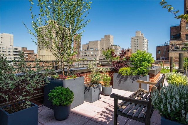 view of patio / terrace featuring a city view