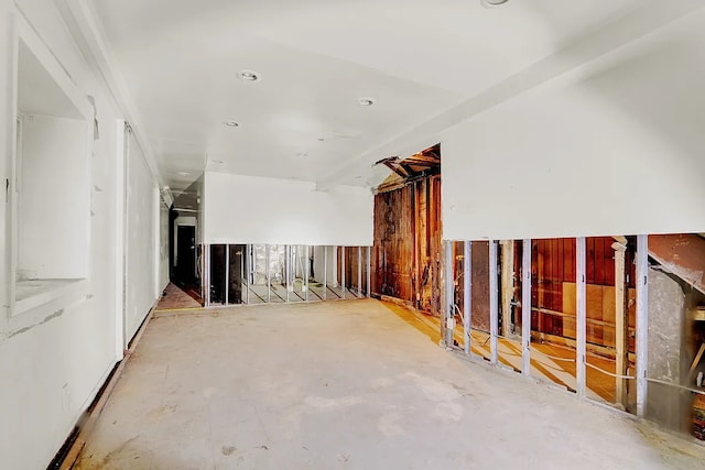 interior space featuring unfinished concrete flooring