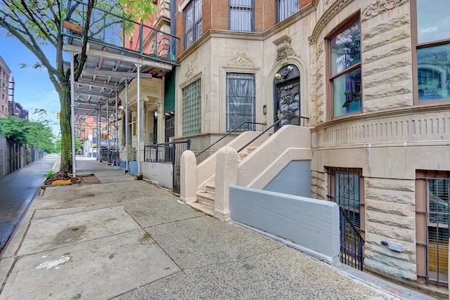 property entrance with brick siding