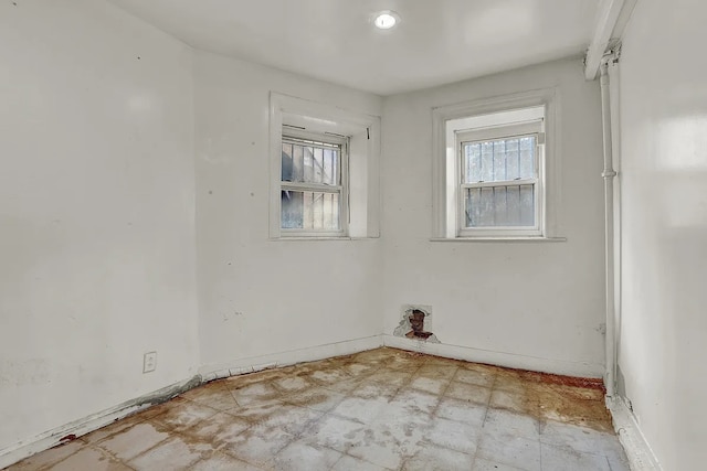 empty room with baseboards