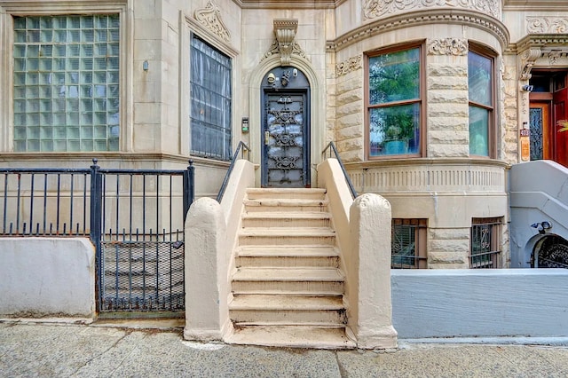 doorway to property with stone siding