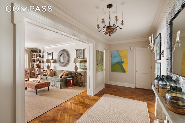 foyer with an inviting chandelier, baseboards, and ornamental molding