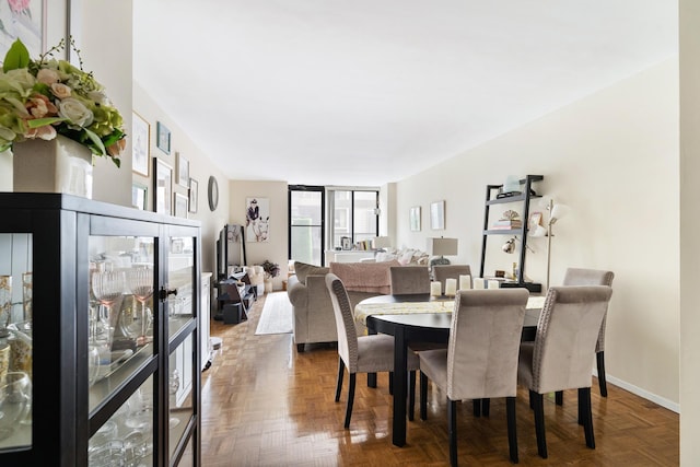 dining space featuring baseboards