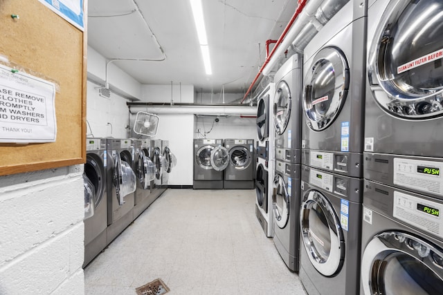 shared laundry with stacked washer / dryer, independent washer and dryer, and light floors