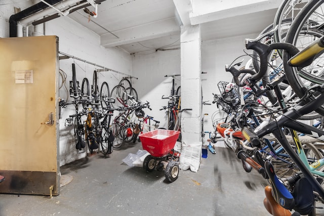 garage featuring bike storage and concrete block wall