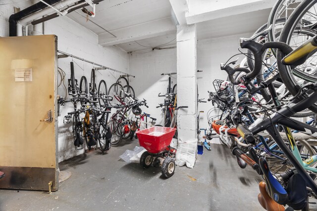 408 W 57th St Unit 6G, New York City, NY 10019 - garage with bike storage and concrete block wall