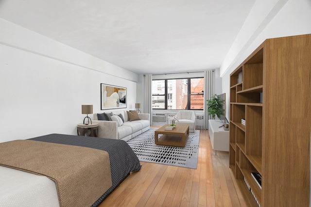 bedroom with hardwood / wood-style flooring