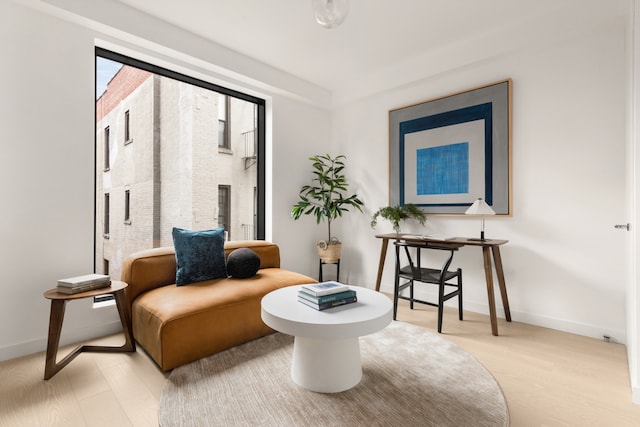 sitting room featuring baseboards