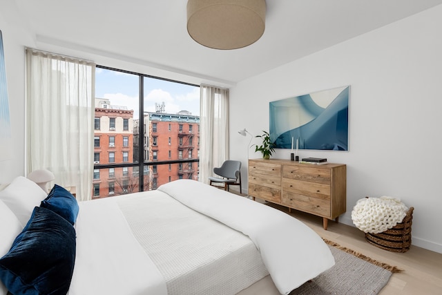 bedroom with wood finished floors