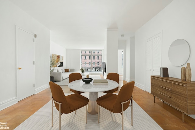 dining space featuring baseboards