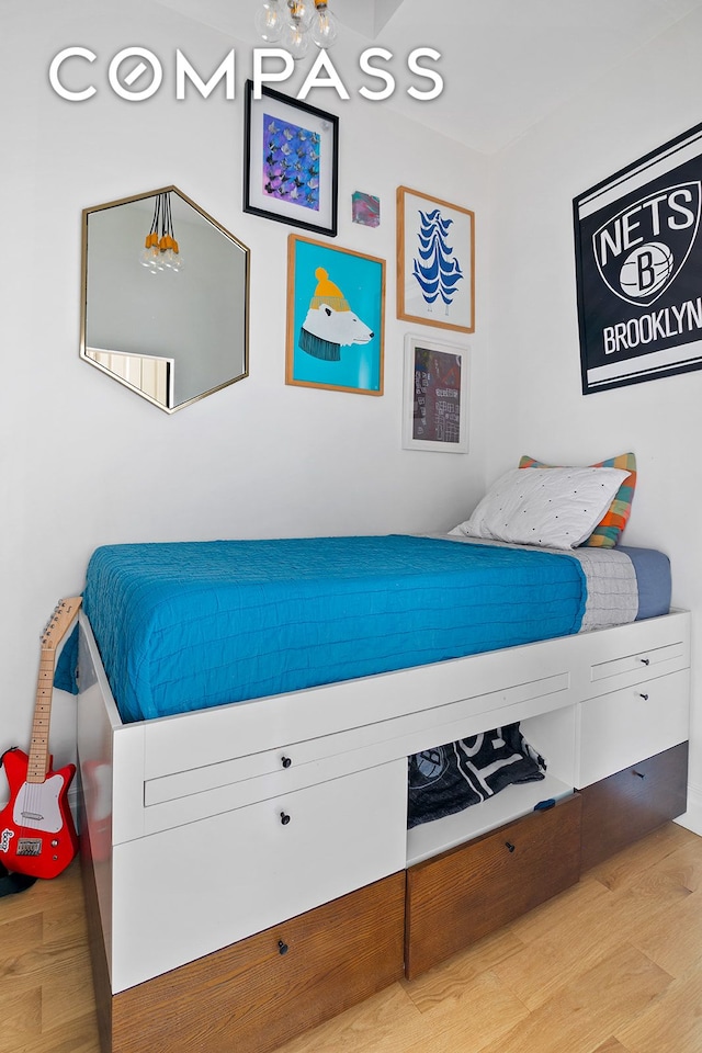 bedroom featuring wood finished floors