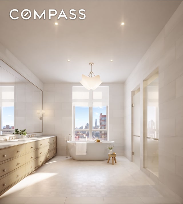 bathroom with a sink, tile walls, a soaking tub, a view of city, and double vanity