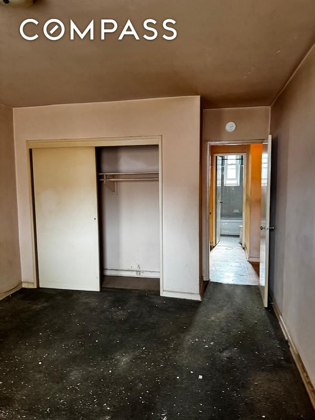 unfurnished bedroom featuring a closet