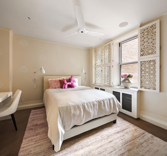 bedroom featuring a ceiling fan, baseboards, and dark wood-style flooring