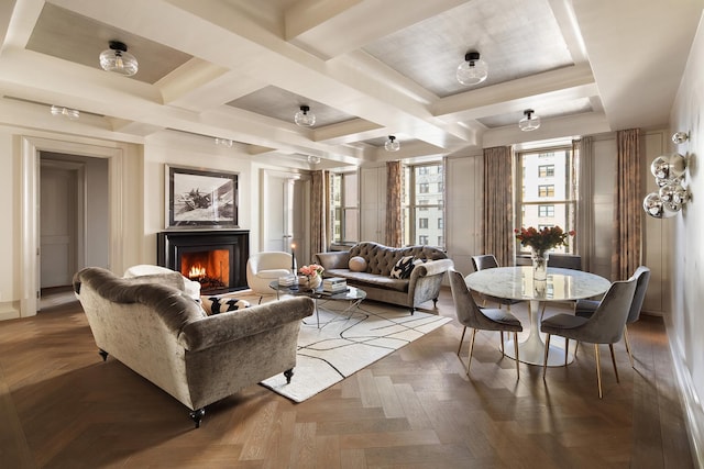 living area featuring a warm lit fireplace, coffered ceiling, and beamed ceiling